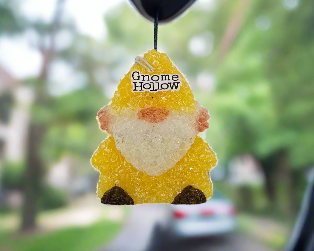 Cactus Blossom gnome air freshener haning from a rear view mirror