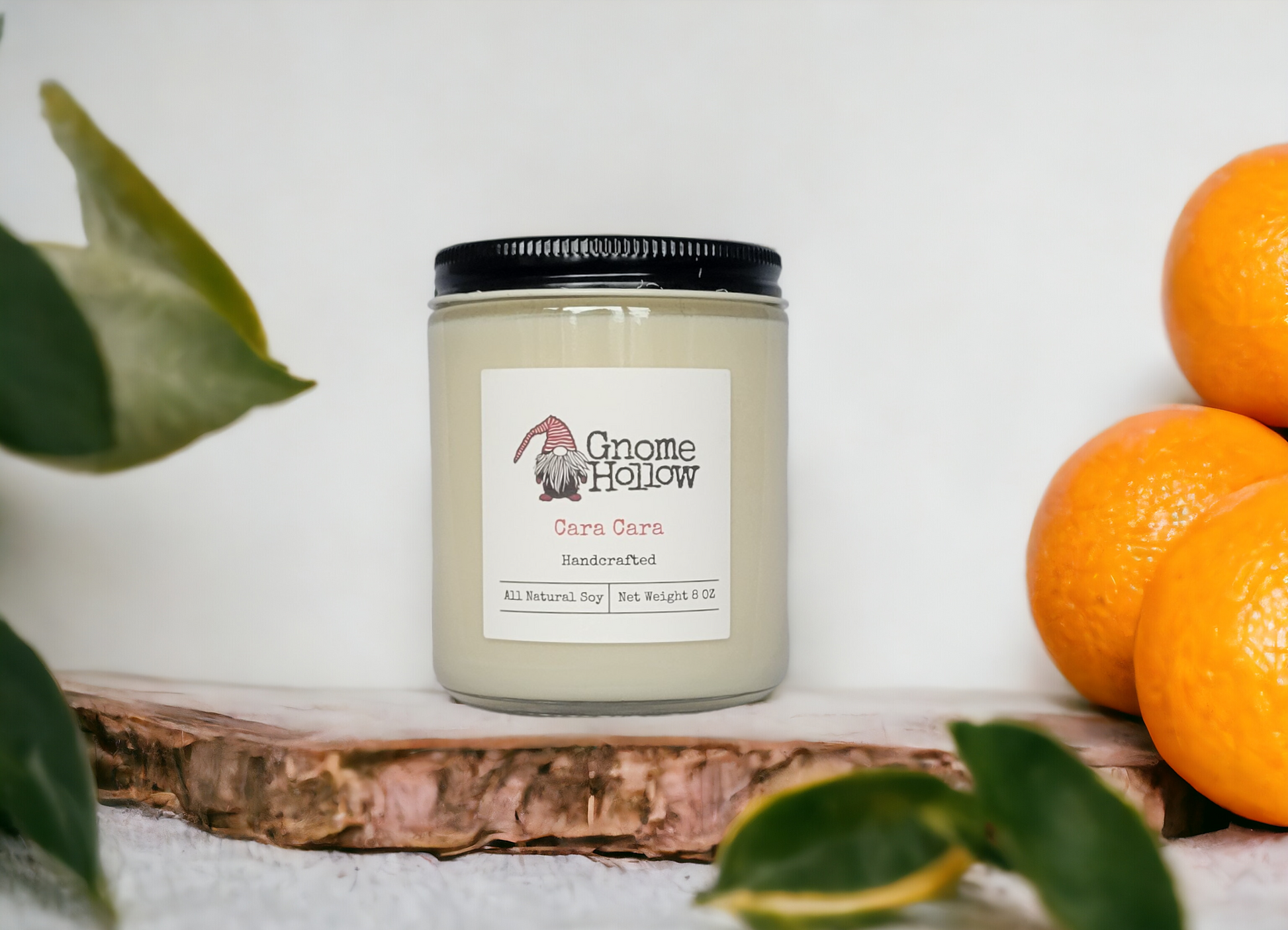 Cara Cara candle surrounded by oranges