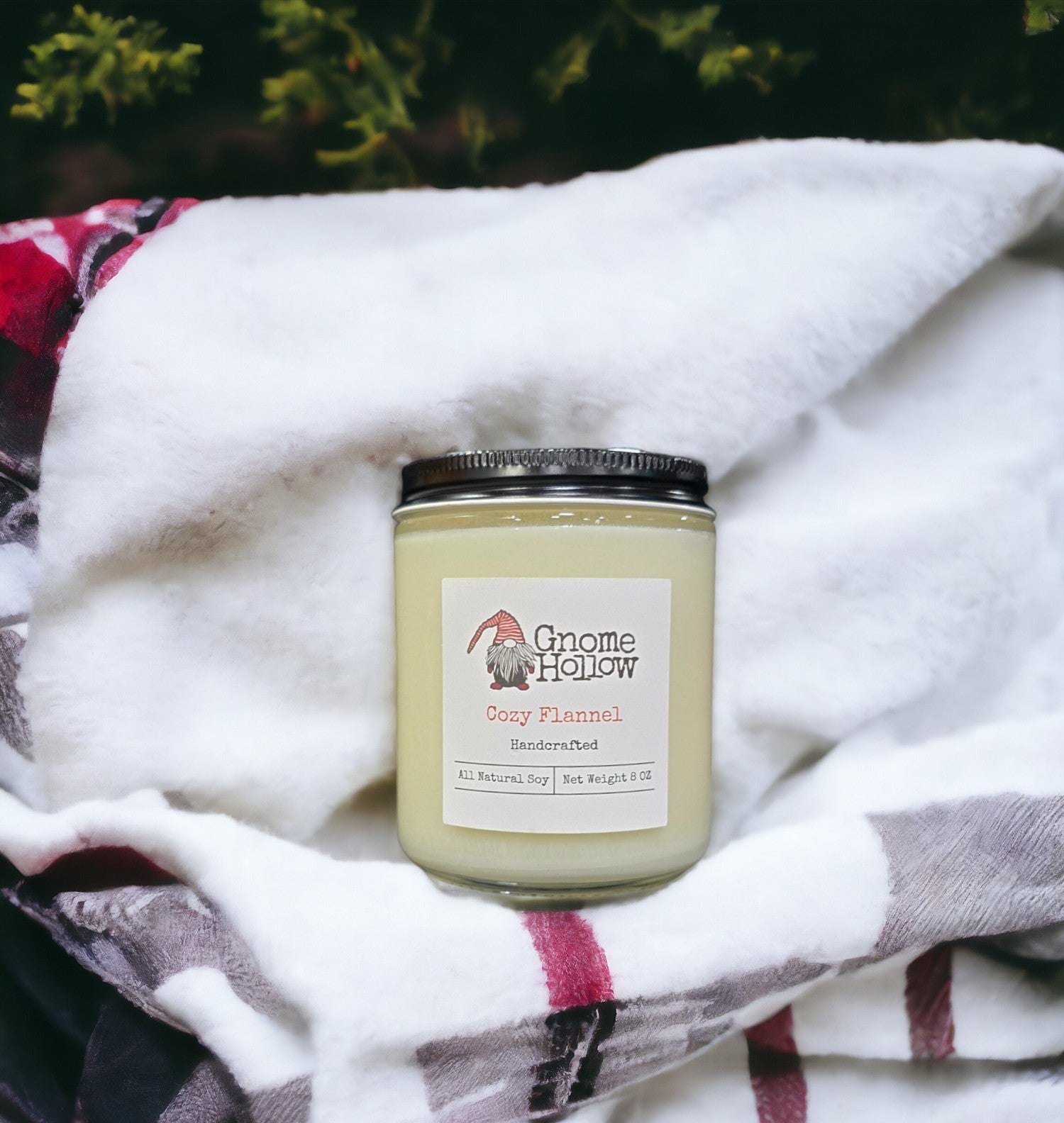 Cozy Flannel candle wrapped in a flannel blanket