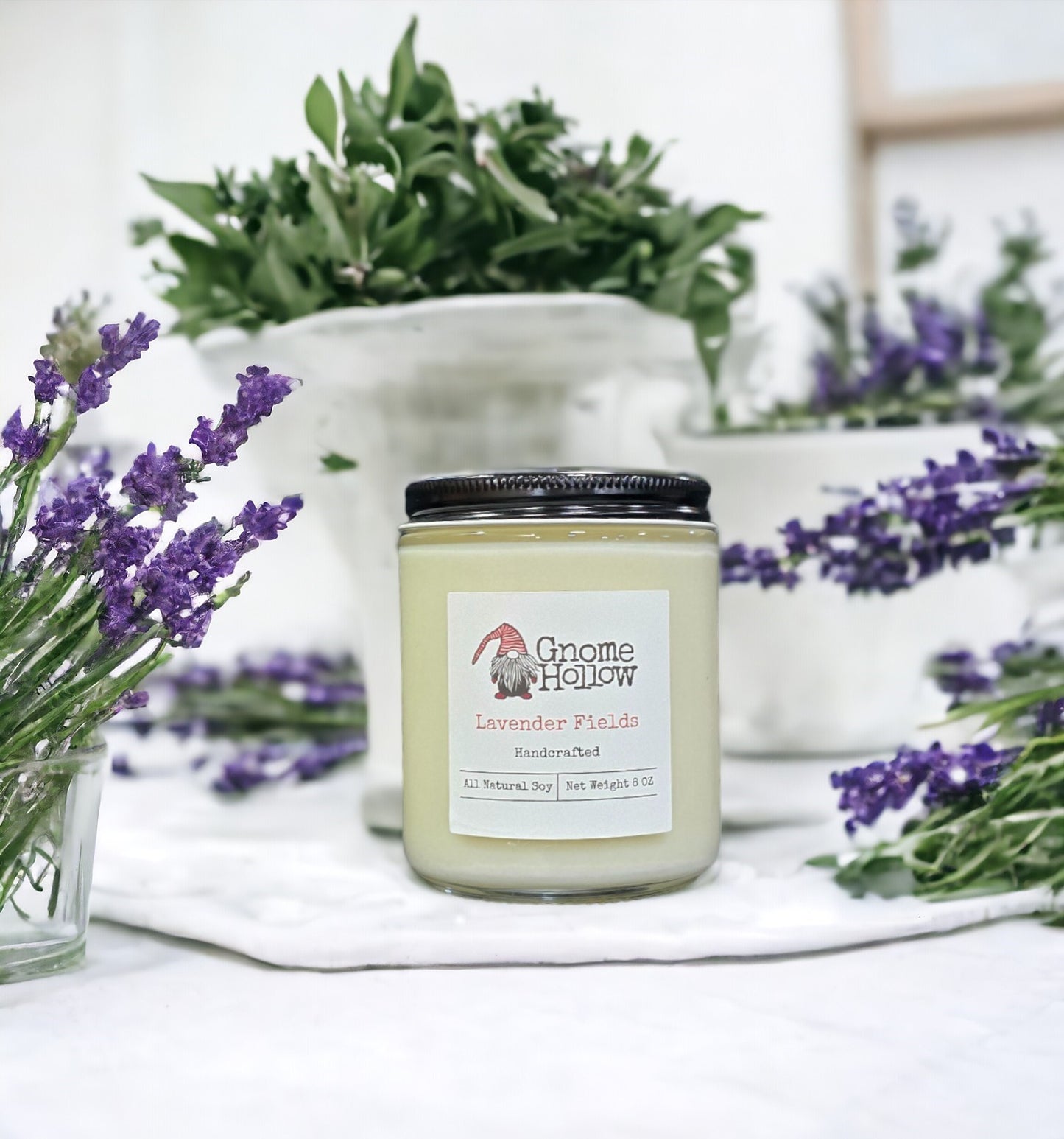 Lavender Fields candle surrounded by sprigs of lavender