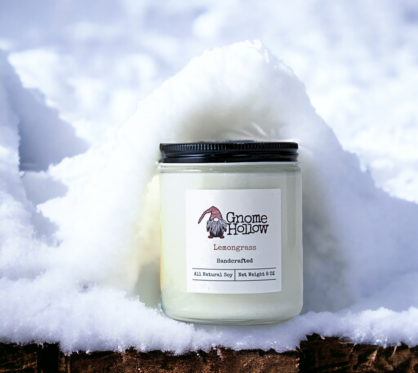 Lemongrass candle in a pile of snow