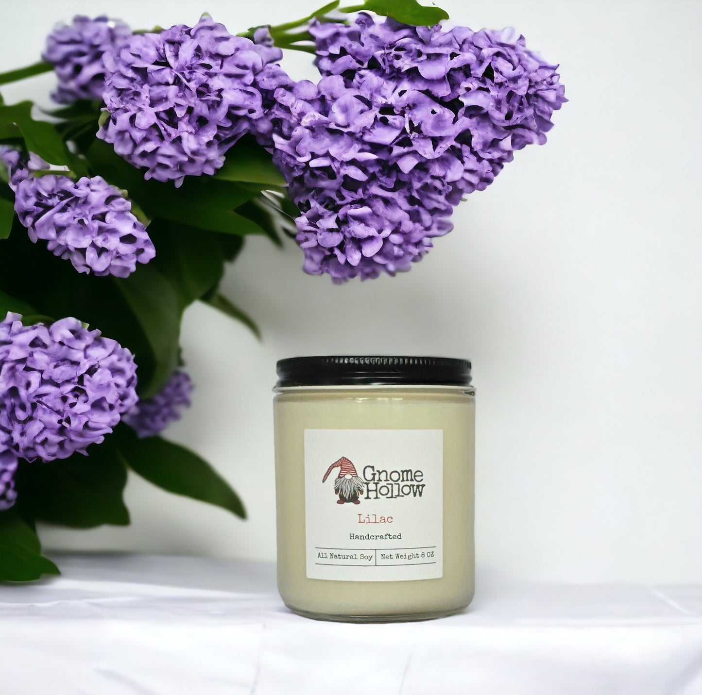 Lilac Candle with a lilac bush hanging over the jar