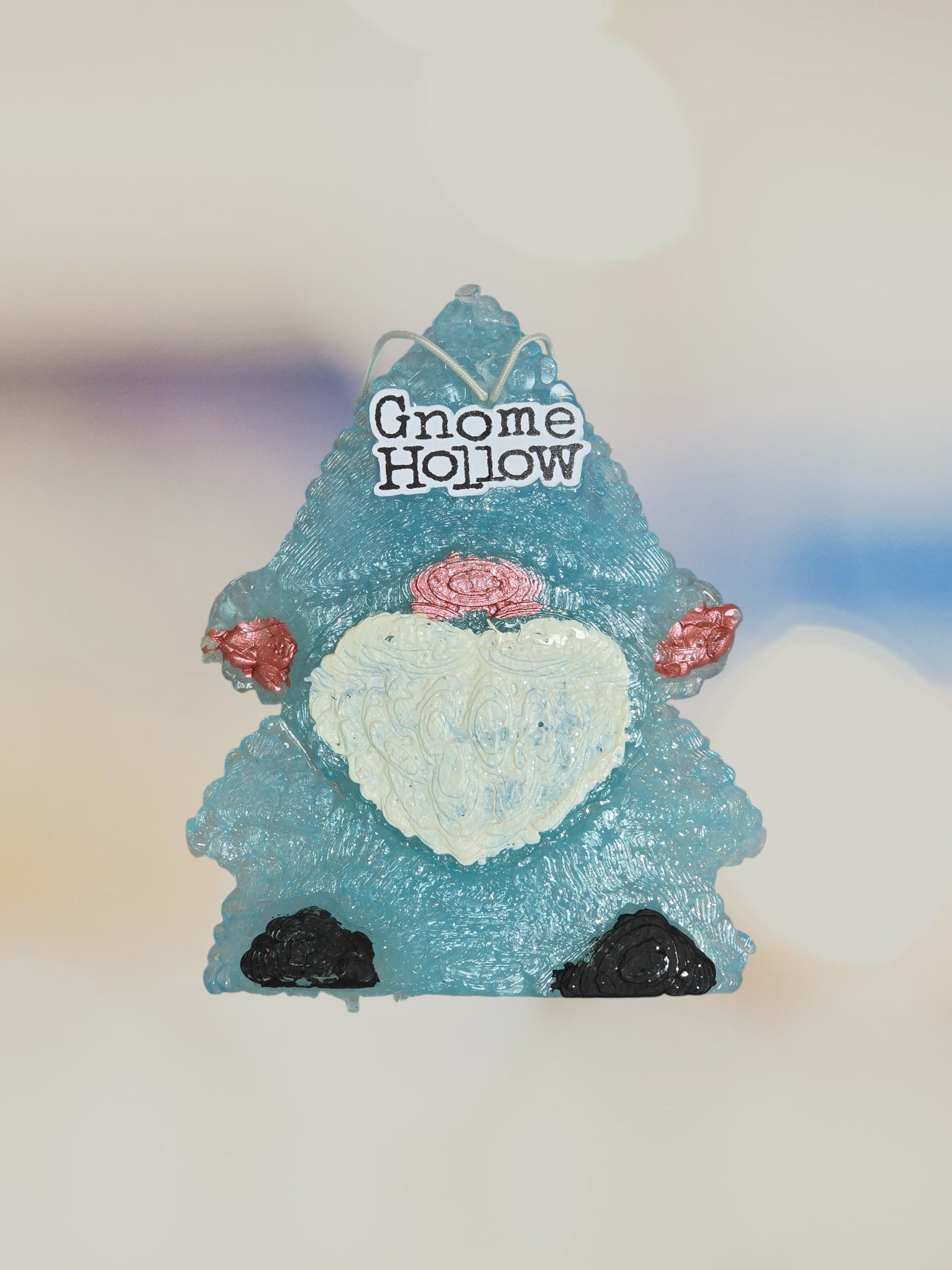 Light blue gnome with a blurred background