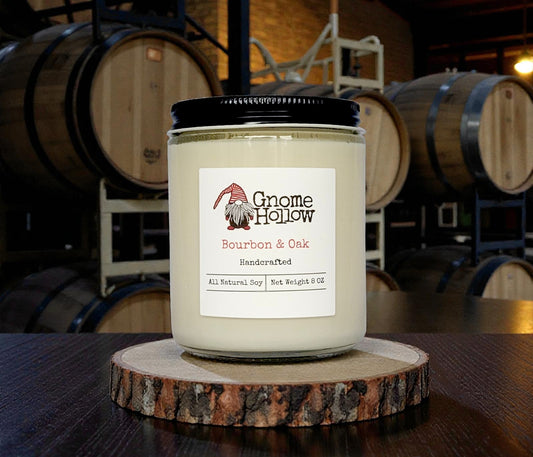 Candle in front of bourbon barrels