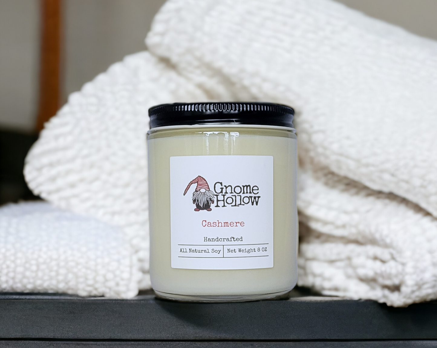 Cashmere candle wrapped in a luxury towel