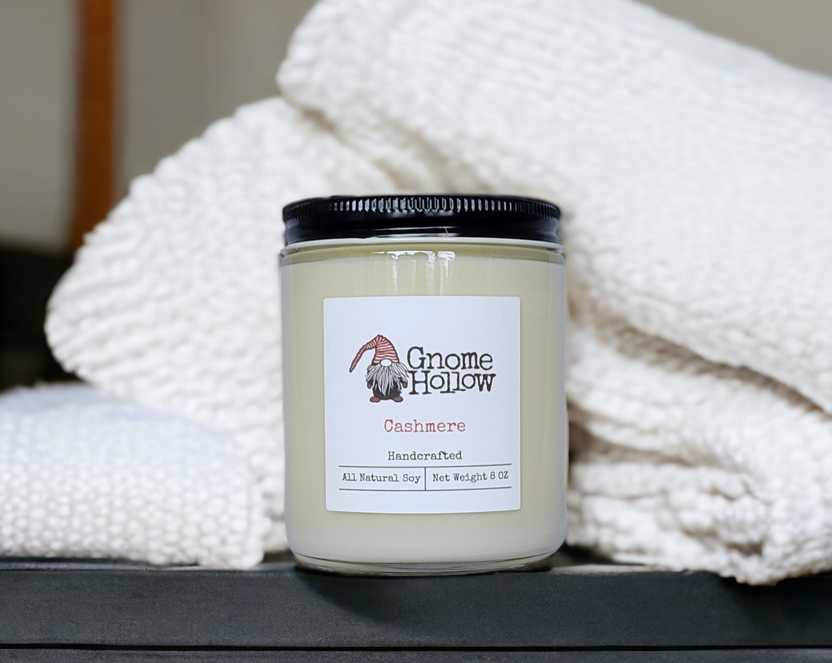 Cashmere candle wrapped in a luxury towel