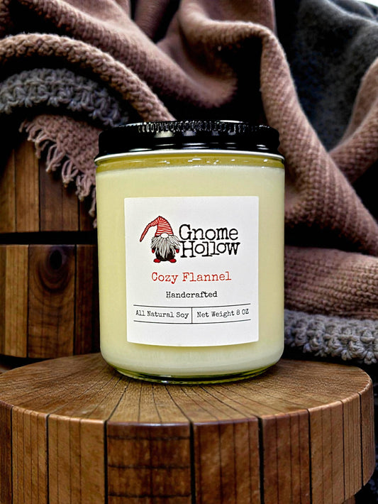 Candle in front of blankets