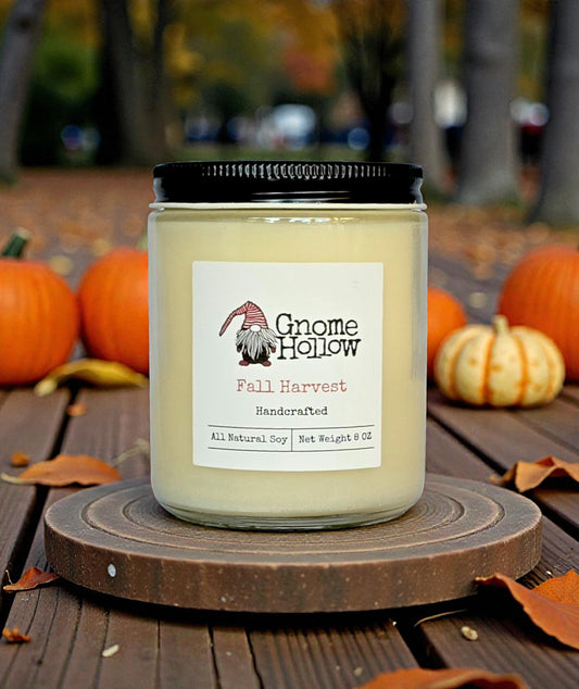 Candle in front of pumpkins