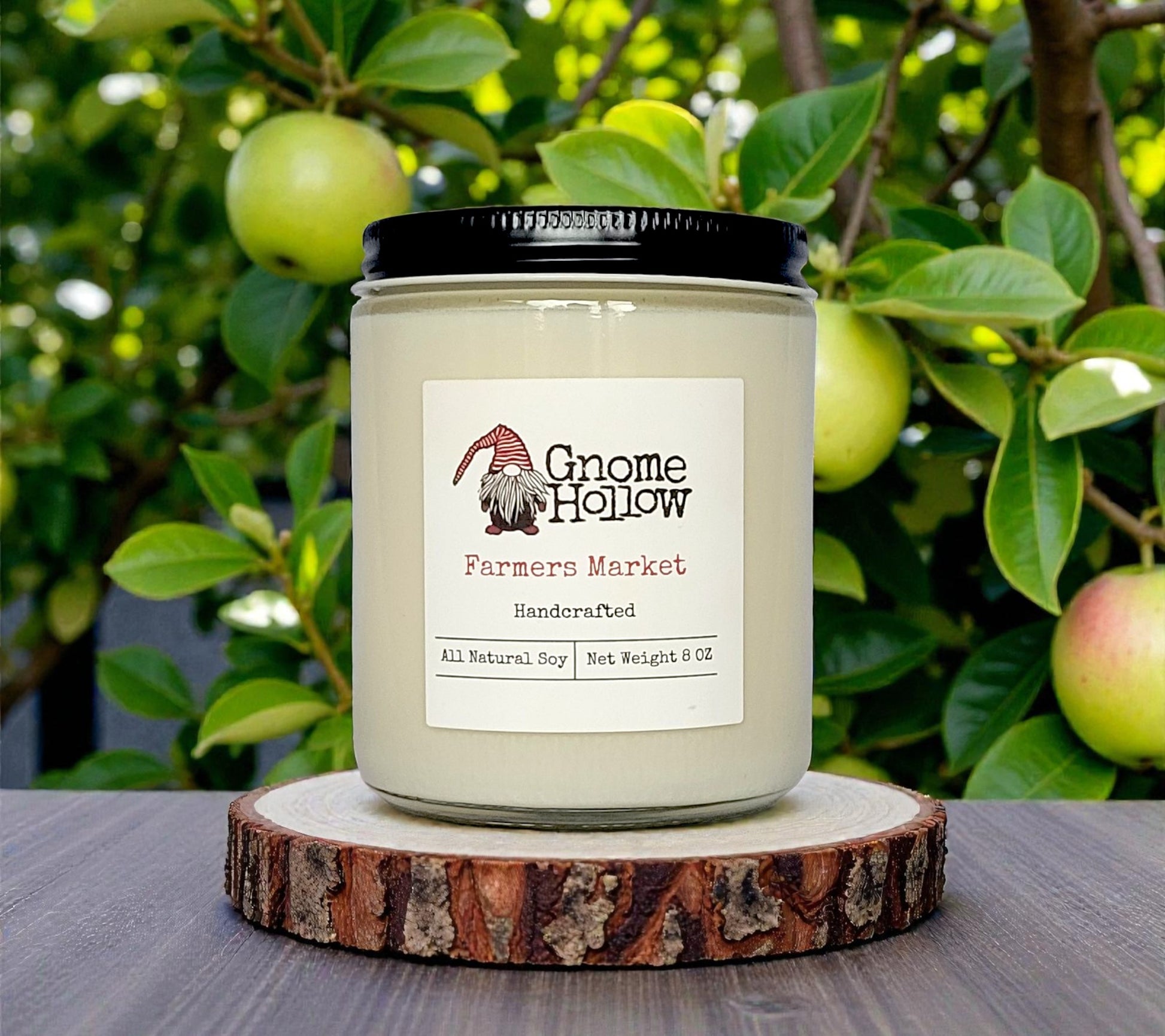 candle in front of green apple tree