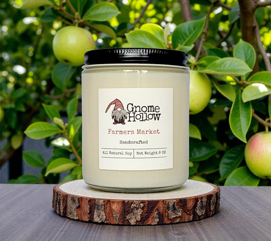 candle in front of green apple tree