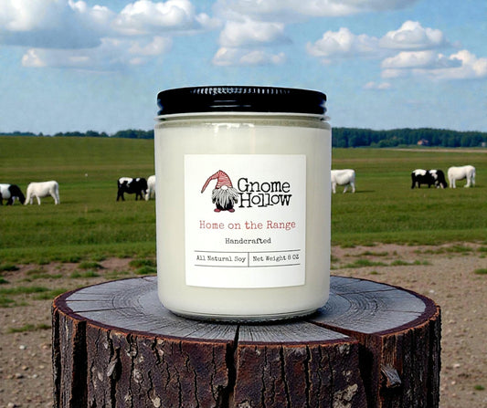 Candle with pasture in the background
