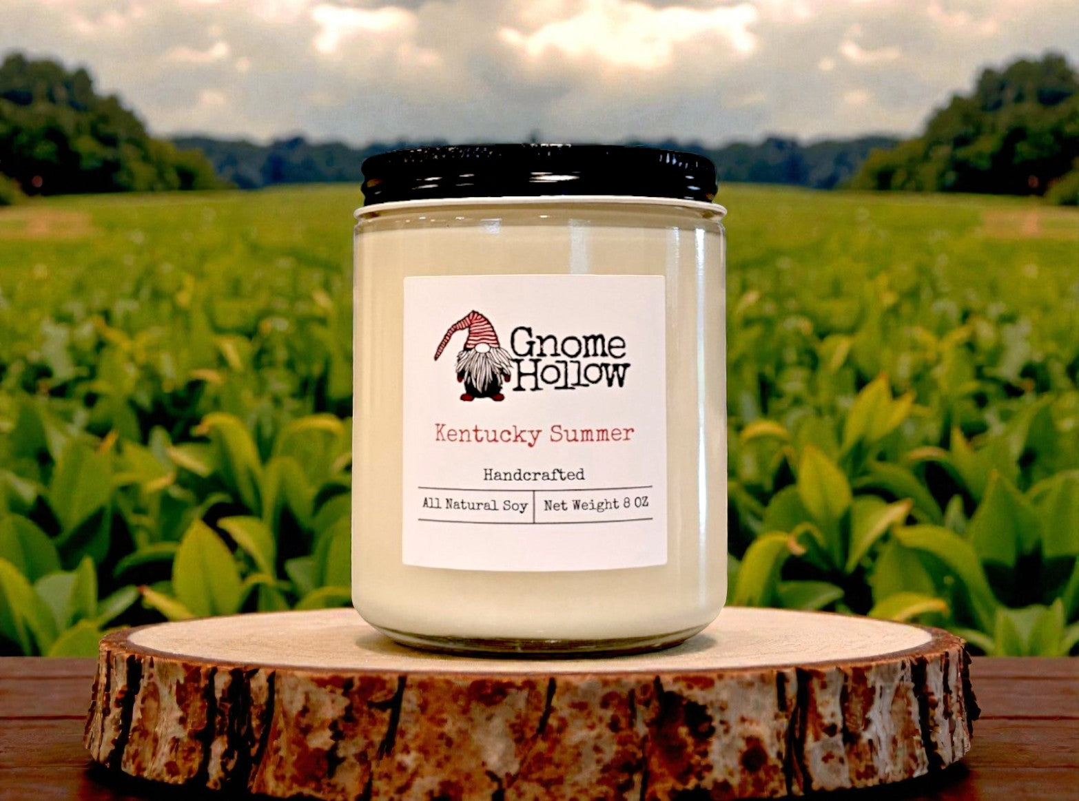 Candle in on a piece of wood with a tobacoo field in the backgrouns