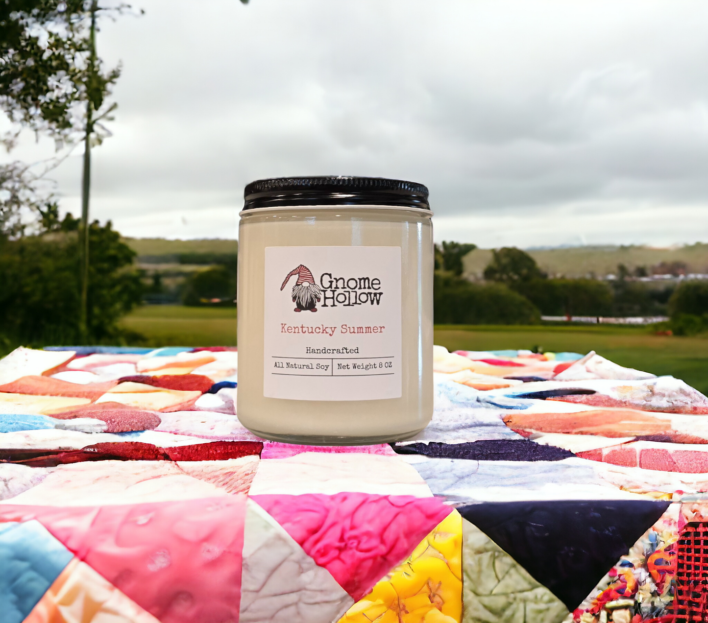 Kentucky Summe candle sitting on a quilt