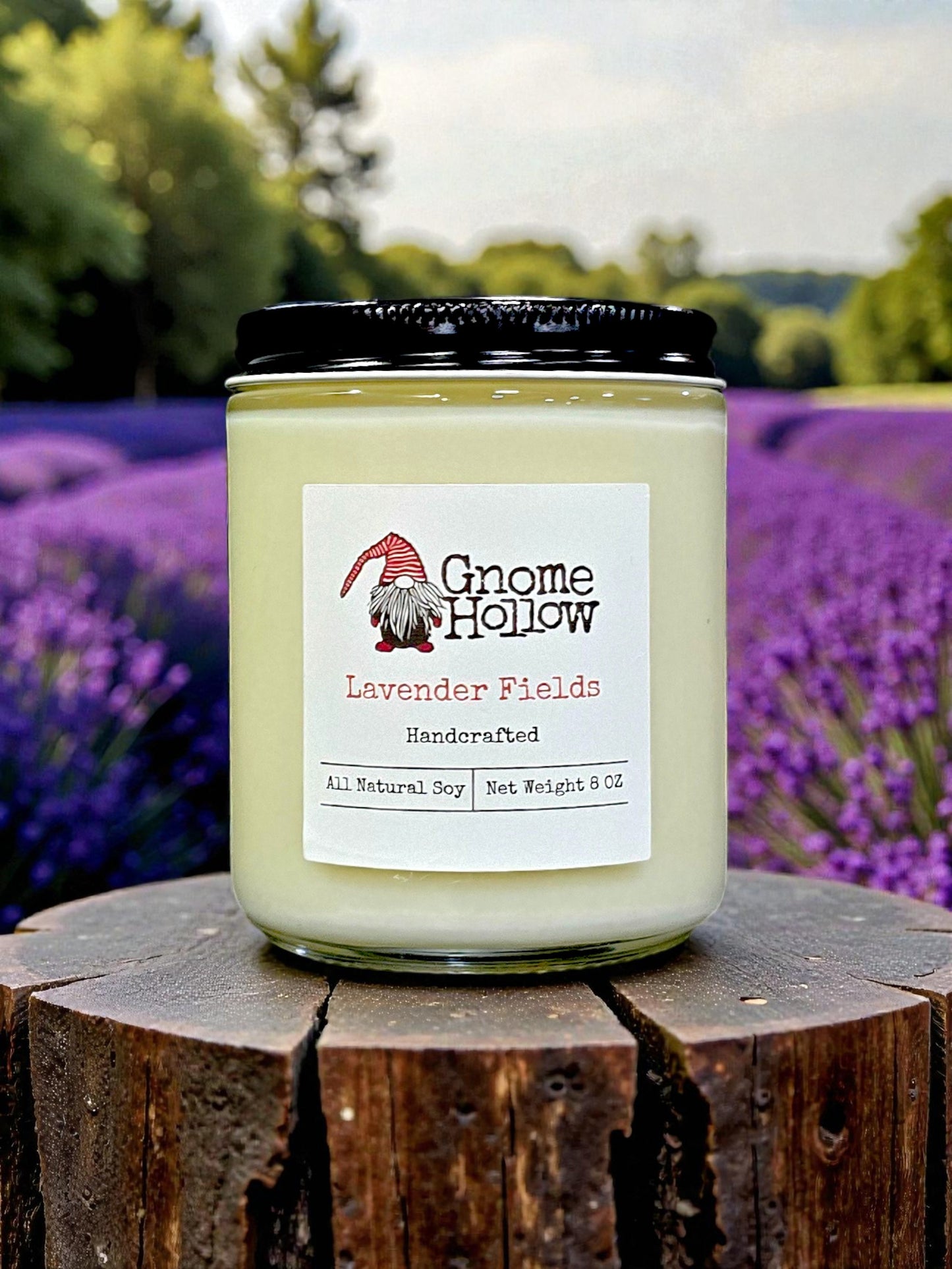 Gnome Hollow Lavender Fields candle on a wooden block with a lavender field background