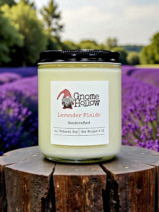 Gnome Hollow Lavender Fields candle on a wooden block with a lavender field background