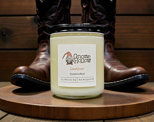Candle in front of cowboy boots