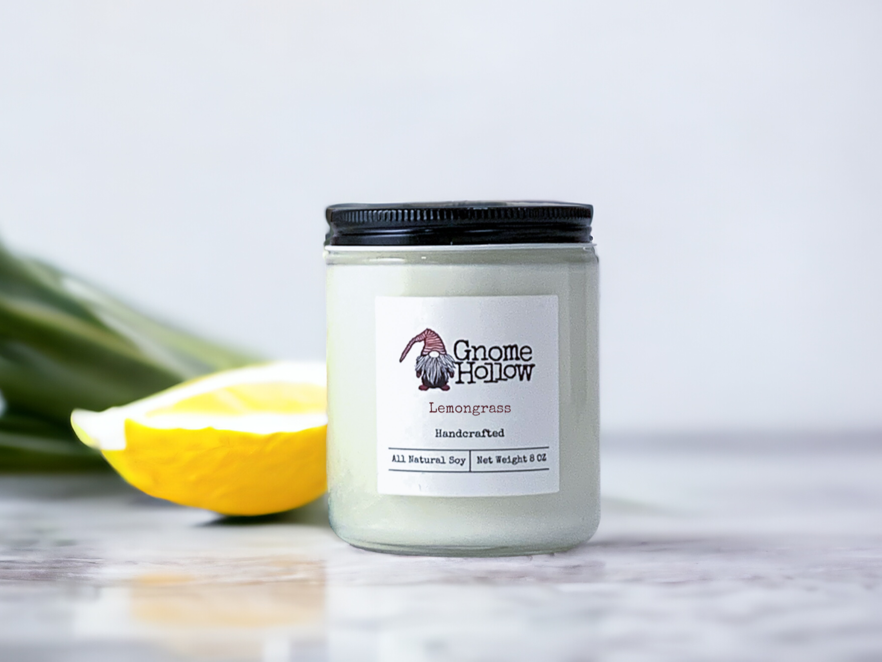 Lemongrass candle with a lemon to the left