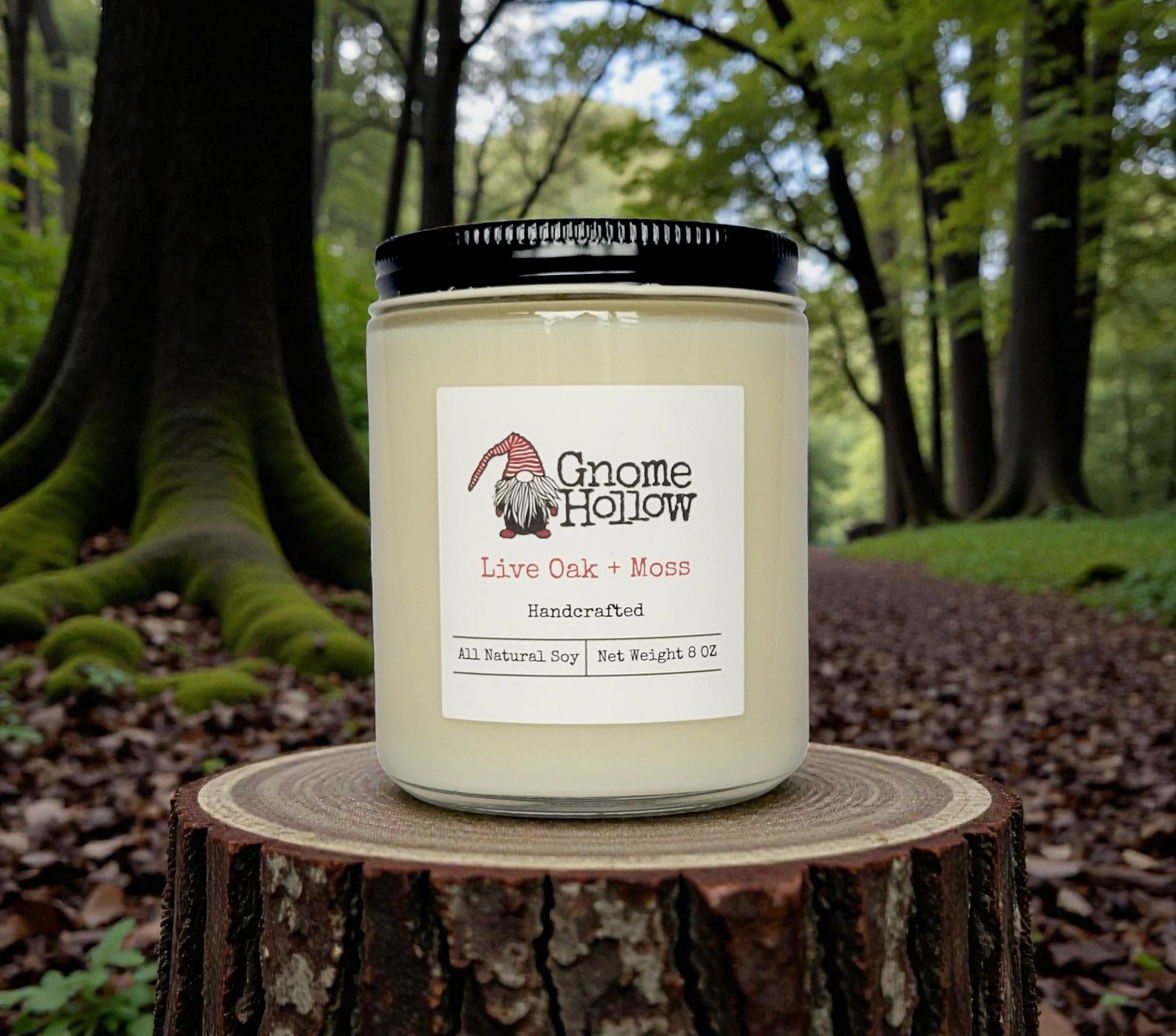 Candle surrounded by mossy oak trees
