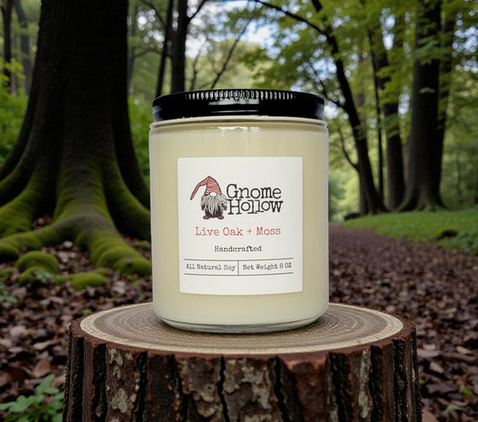 Candle surrounded by mossy oak trees