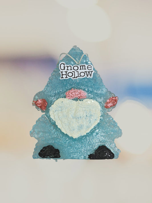 Light blue gnome with a blurred background