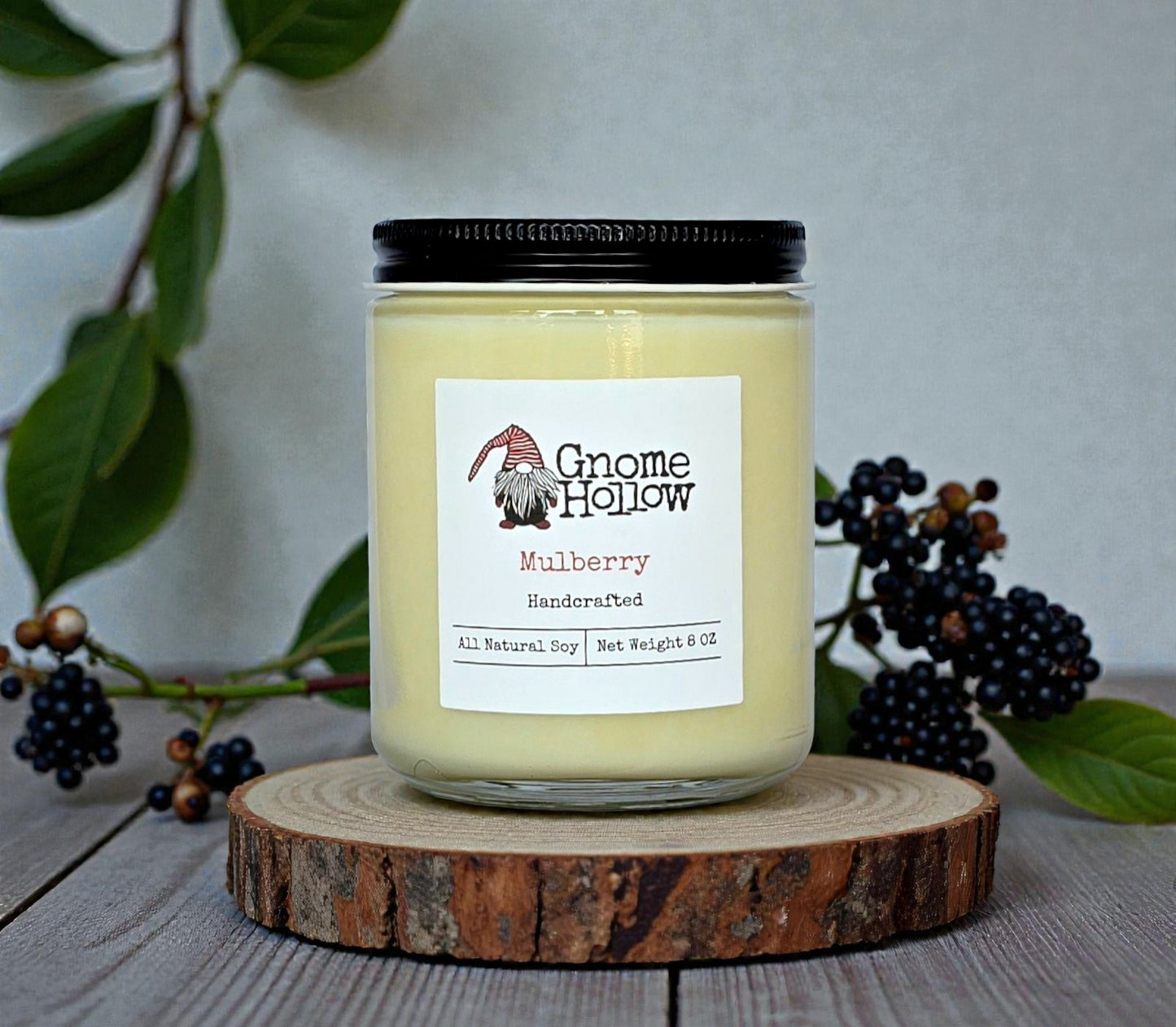 Candle in front of mulberries