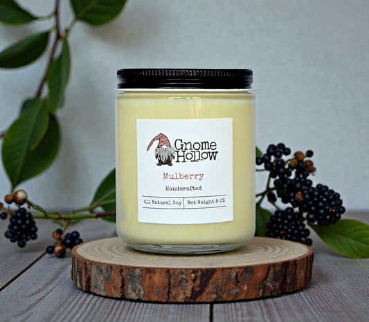 Candle in front of mulberries