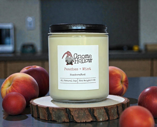 Candle in front of peaches