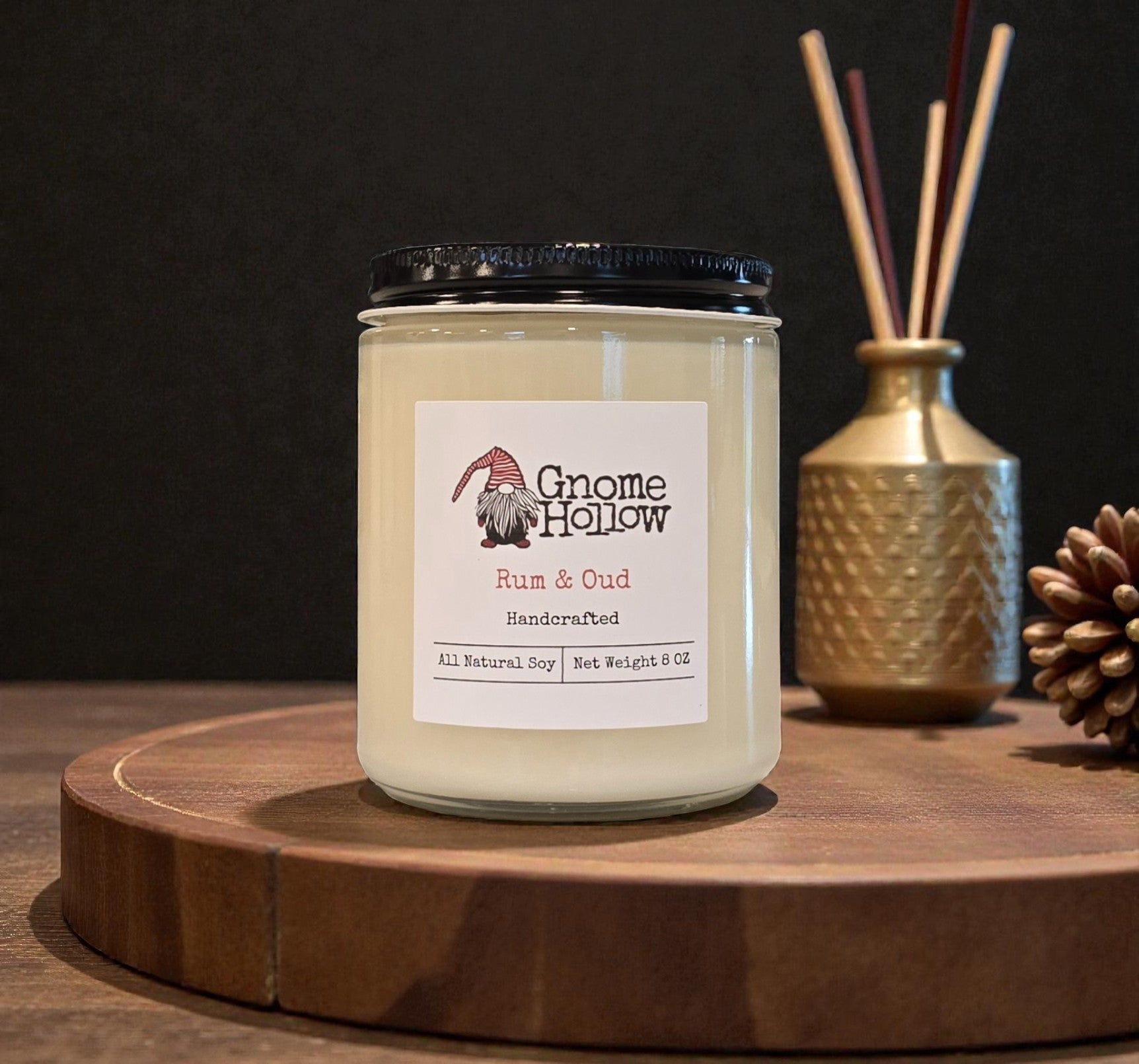 Candle with incense in the background