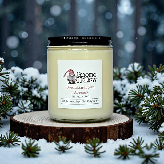 Candle with snow & evergreen