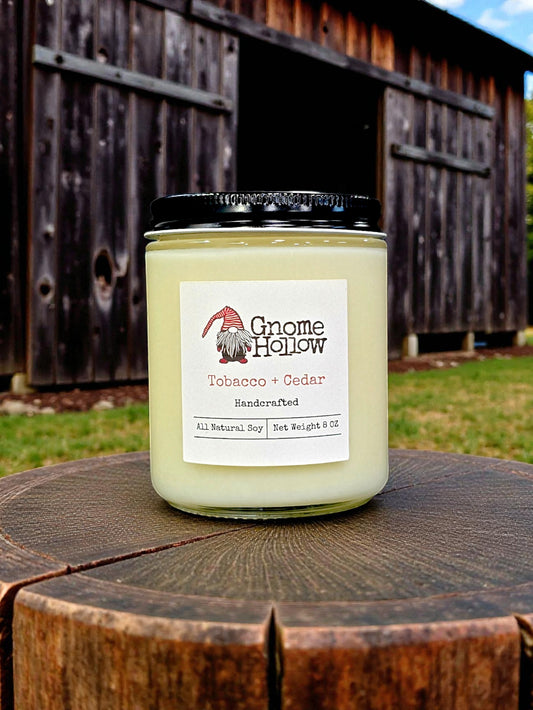 Candle in front of a tobacco barn