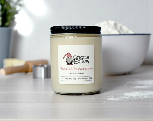 Vanilla Buttercream candle with a kitchen backdrop featuring a bowl of flour and a rolling pin.