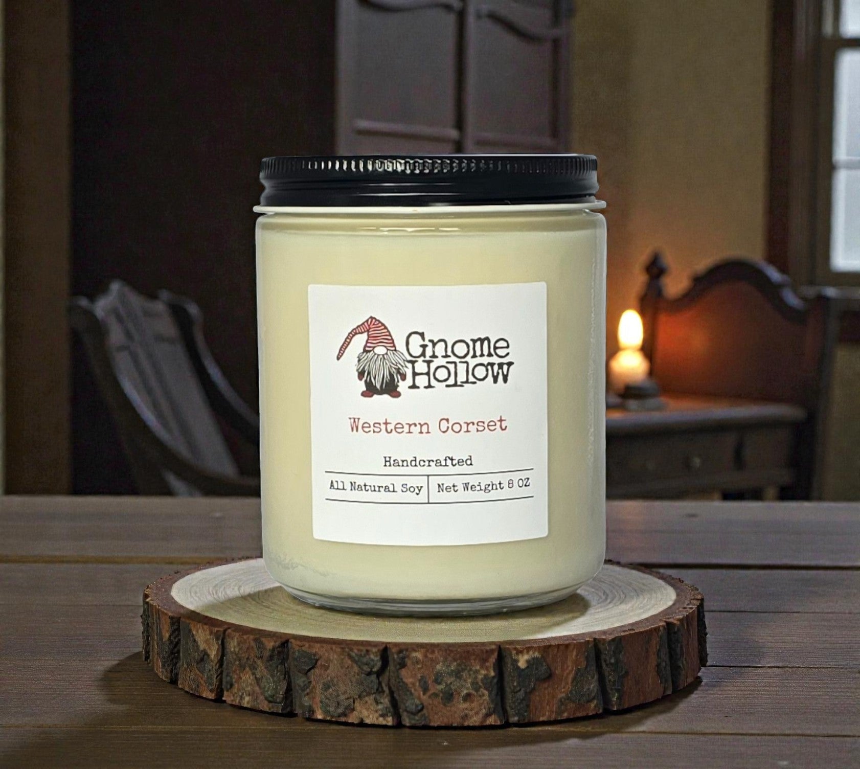 Candle on wood piece with old time bedroom in background