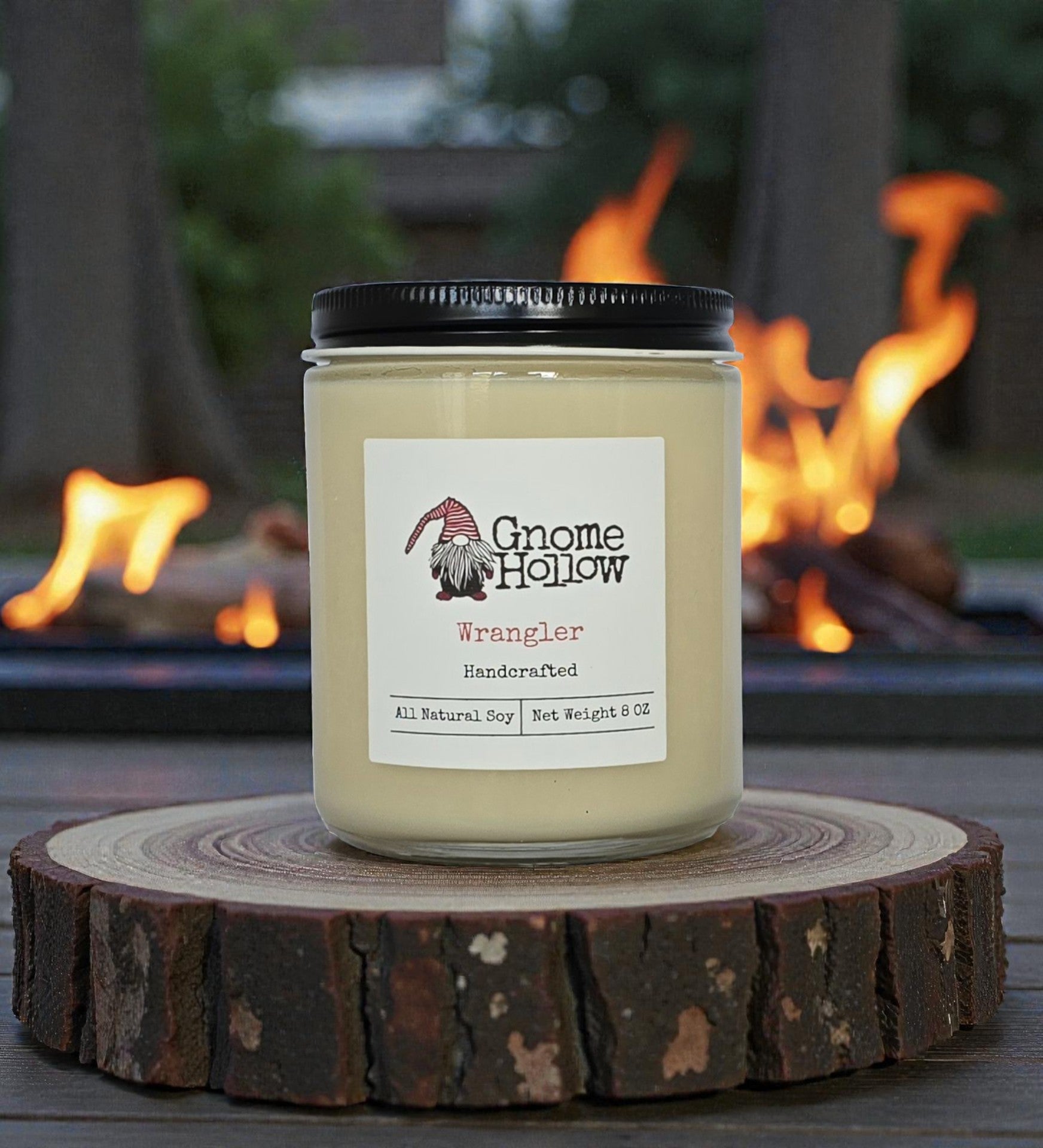 Candle in front of a fire pit